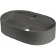 Granite countertop washbasin with a faucet island - oval
