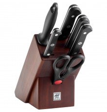 Set of 4 knives in a walnut block