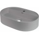 Granite countertop washbasin with a faucet island - oval